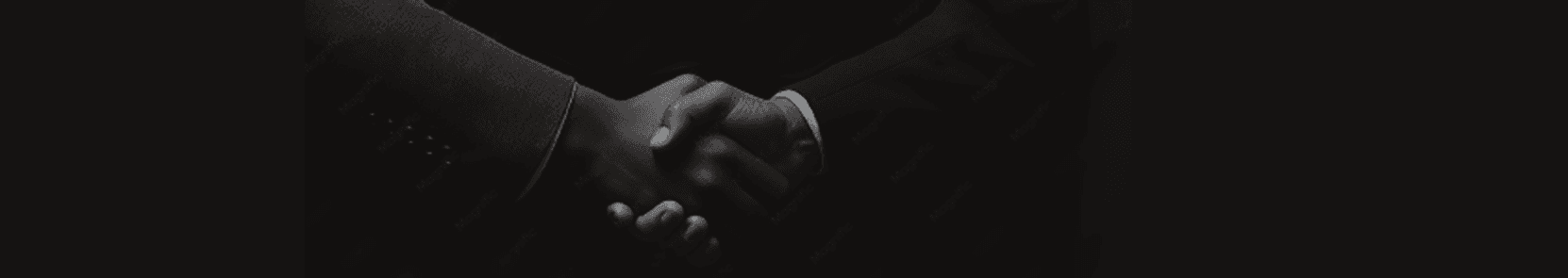 A monochrome business handshake
