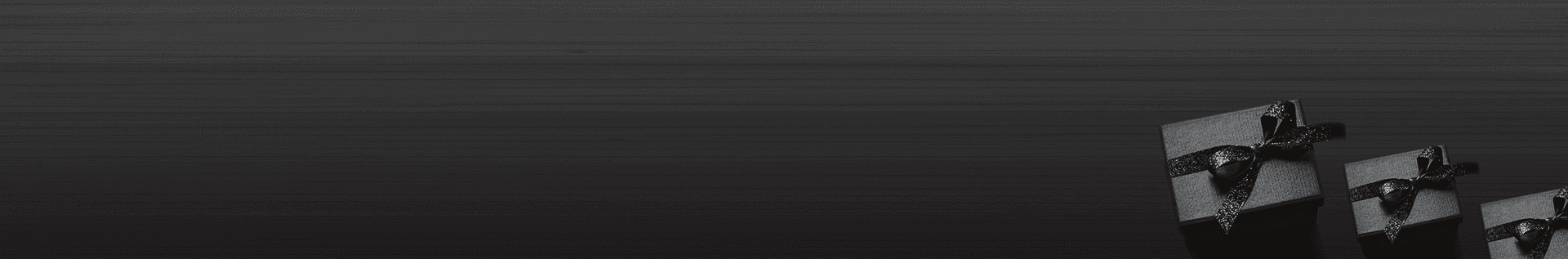 Monochrome gift boxes on a dark background